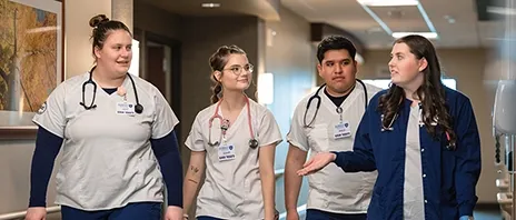 Nursing students walk and talk.